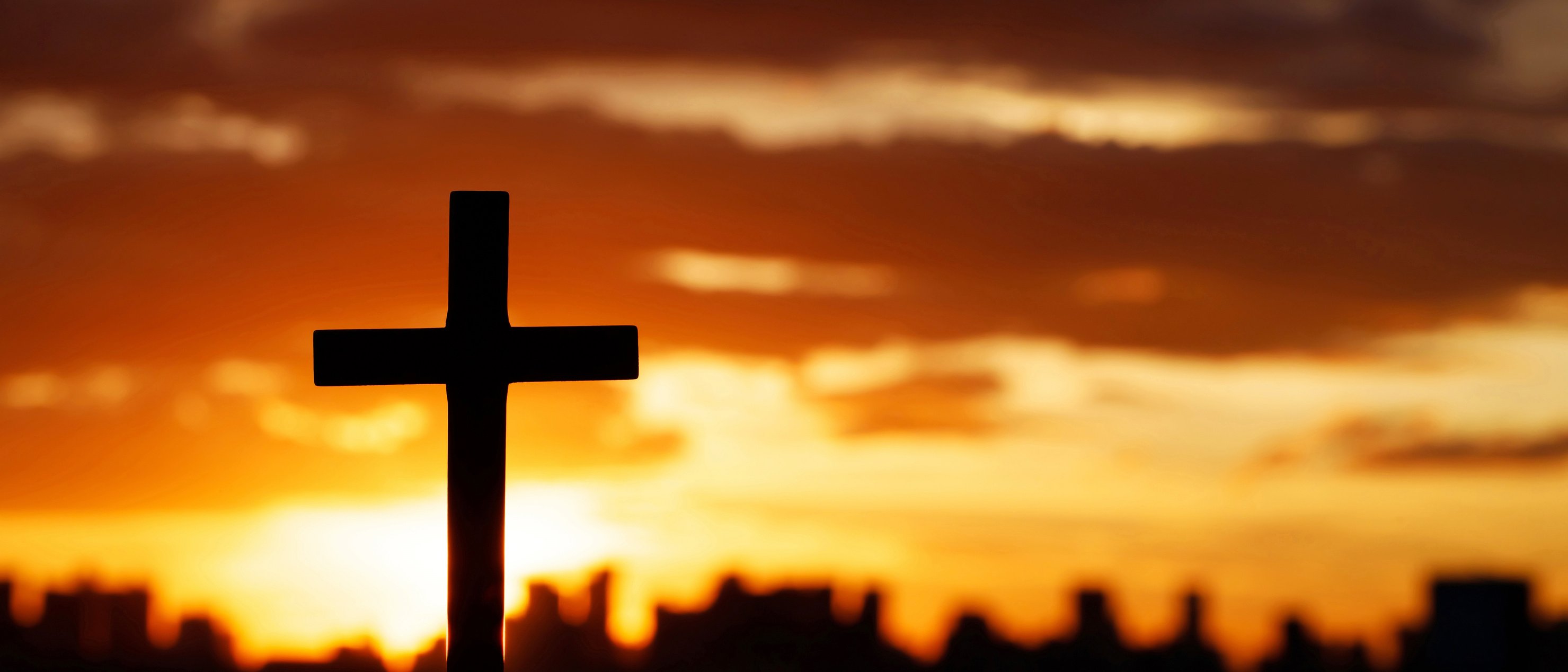 Silhouette of a Cross at Sunset